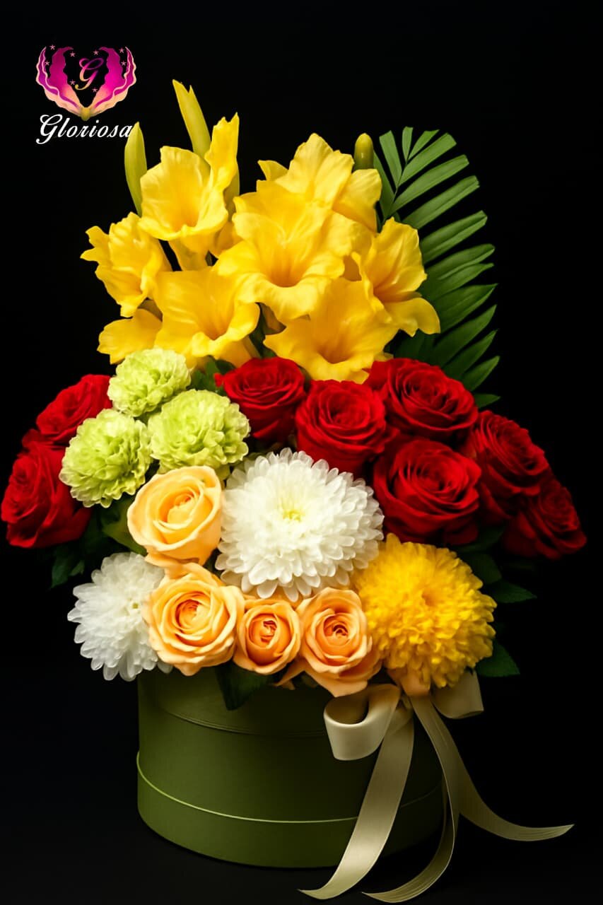 Colorful gladiolus and roses arrangement in olive box