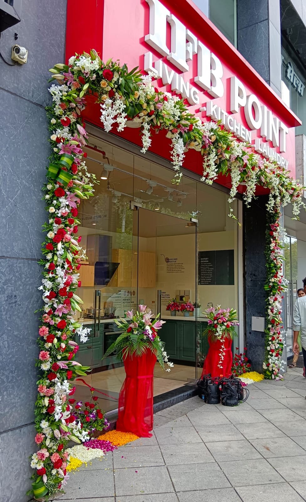 IFB Point store opening floral arch decoration with lilies and roses