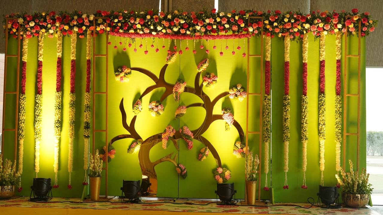 Artistic tree backdrop stage decoration with fresh flowers by Gloriosa